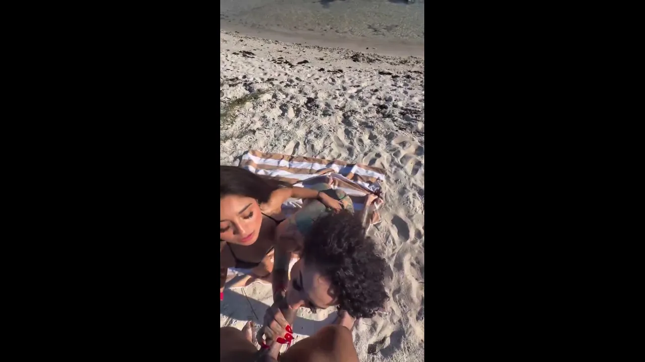 Big dick Mexican gets sucked by 2 Latinas on the beach